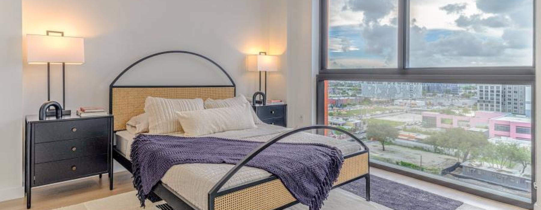 a bedroom with a large window