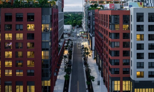 Close to the center of everything a street between 2 large buildings
