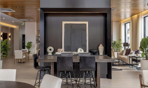 a room with a fireplace and chairs